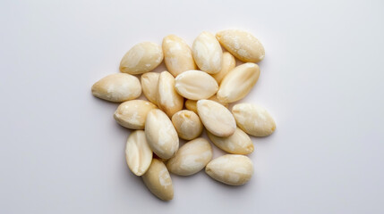 White blanched almond nuts on white background. Ideal for healthy eating, snacks, and nutrition concepts.