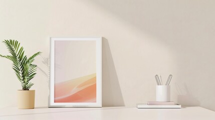 A flat lay of a single framed photo, a small plant, and a minimalist desk organizer on a clean desk