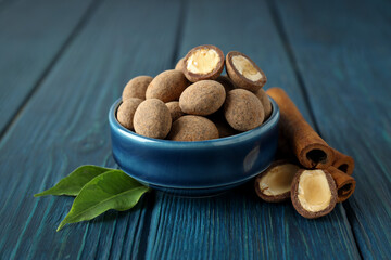 Almonds in chocolate, concept of tasty sweet food