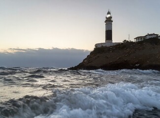 Lighthouse on the coast of the sea. 