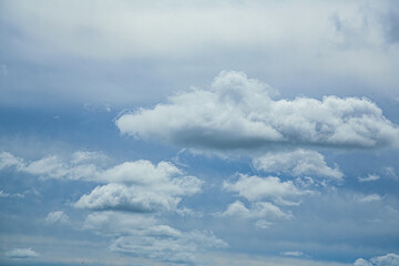 Fototapeta premium High cloudiness. Overcast weather. Clouds over a green field. Beautiful background