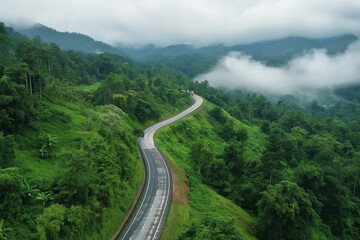 Aerial top view of road in the mountain forest, transportation camping concept.