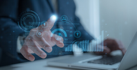 businessman on document planning the business plans and analyse  profitability of working companies with digital augmented virtual graphics for project manager working on laptop and update information