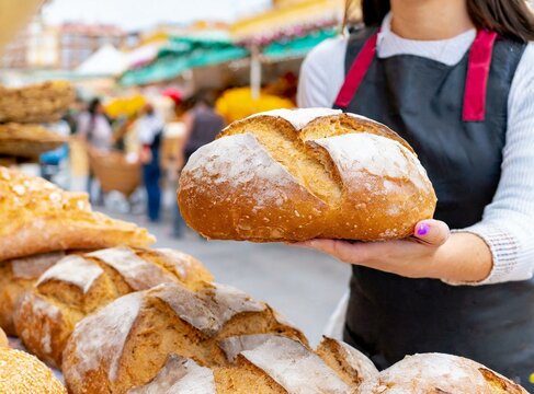 Freshly baked bread at street market closeup. ''Country Bread''.
