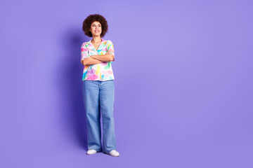 Full size photo of pretty young woman crossed arms look empty space wear shirt isolated on violet color background