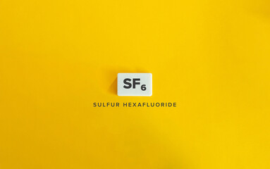 Sulfur Hexafluoride (SF₆). Greenhouse Gas (GHG). Text on Block Letter Tile on Yellow Background. Minimalist Aesthetics.
