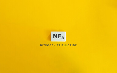 Nitrogen Trifluoride (NF₃). Greenhouse Gas (GHG). Text on Block Letter Tile on Yellow Background. Minimalist Aesthetics.