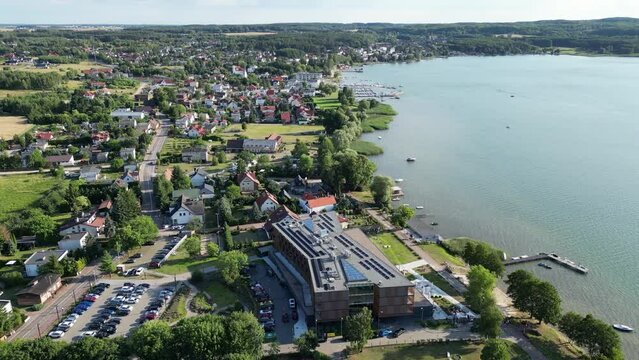 village of charzykowy poland aerial panning with notera hotel and lake harbor port marina high end luxury resort and spa holiday travel destination