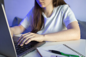 The girl writes typing in a notebook. Back to school. Back to school. School years