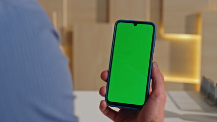 Manager watching video mockup cellphone in office close up. Businessman hand