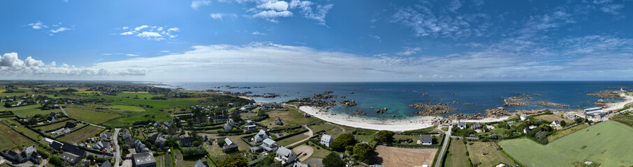 Aerial view of Pontusval Lighthouse and the beaches. Plounour-Brignogan-Plages, France. Rocks singularly shaped. Boats moored in the Atlantic Ocean