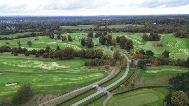 golf course country club luxury resort aerial forward movement road golf buggy carts