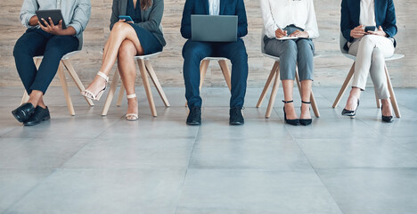 Group, recruitment or legs on chair with tech for interview, strategy with onboarding in office. Business people, row or corporate with staff diversity for human resource, inclusion or research