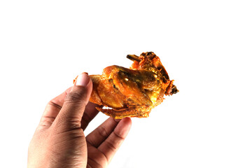 close up of hand holding fried chicken, isolated on white background