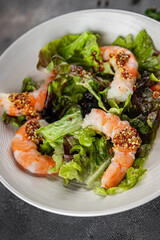 salad shrimp or prawns langoustines green leaf lettuce mix fresh meal food snack on the table copy space food background rustic top view