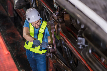 Engineer checking construction process railway and checking work on railroad station . Railway...