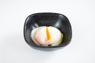 Onsen tamago  (Unlike with soft boiled egg, its yolk is hard while its white is soft)