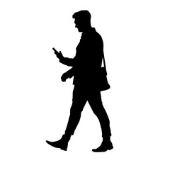 Silhouette of a man walking while using a smartphone