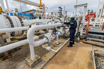 Male worker inspection and measurement thickness pipeline oil and gas at check record pipeline