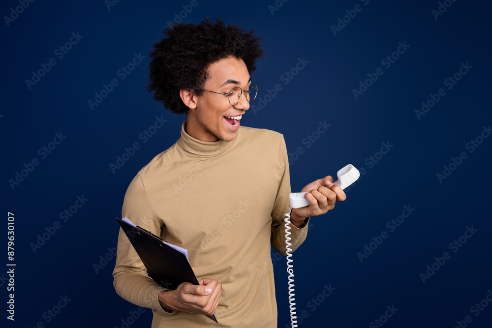 Poster photo portrait of handsome young man phone call paperholder dressed stylish beige garment isolated o