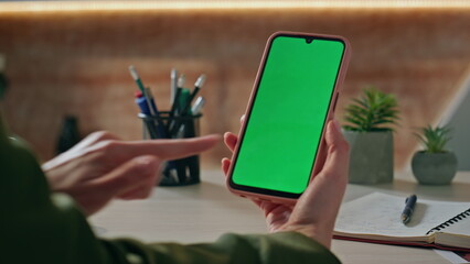 Employee tapping mockup cellphone workplace closeup. Woman hand surfing web