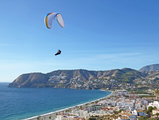 Paragliding above La Herradura beach in Andalucia, Spain	