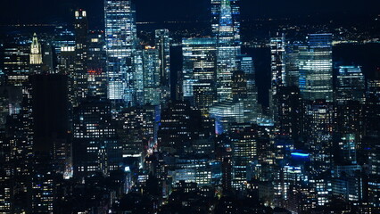Naklejka premium The New York city night view with the lights on in the skyscrapers at night