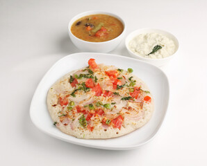Uthappam or Uttapam is a type of dosa from southern India that is thicker, with tomato, onion, chilli packets.