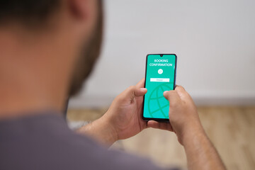 Online booking. Buying tickets and service online. Ordering service in online shop using smartphone. Order confirmation on screen.