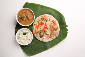 Uthappam or Uttapam is a type of dosa from southern India that is thicker, with tomato, onion, chilli packets.