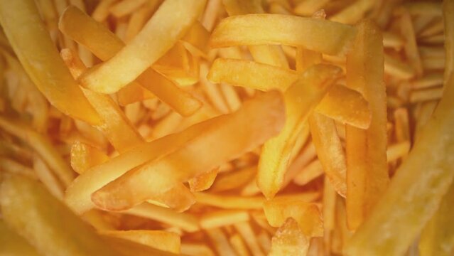 Super Slow Motion Shot of Falling French Fries Followed by Camera at 1000 fps.