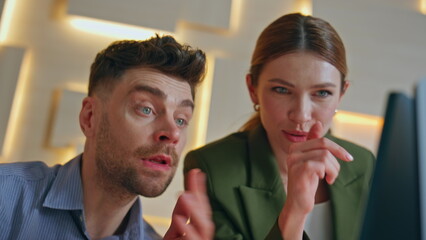 Couple colleagues discussing ideas interacting together in modern office closeup