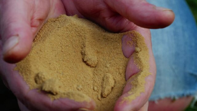 Handful of sand close up 