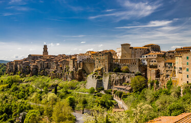 A glimpse of the ancient medieval village of Pitigliano, in the province of Grosseto, Tuscany, Italy. Is known as the little Jerusalem. The old stone houses built overlooking a spur of tuff rock.