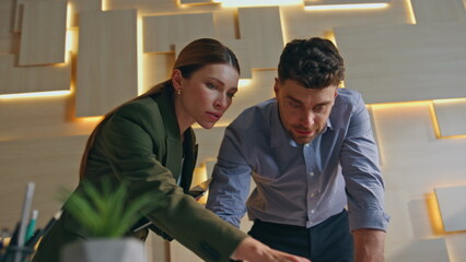 Obraz premium Two architects working draft at building company office close up. Engineers plan