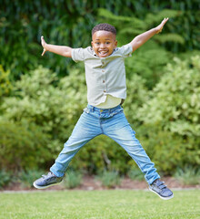 Jump, play and excited for black boy in garden, portrait and park for holiday in nature. Backyard, smile and face for happy child person, outdoor and alone in San Francisco for school vacation