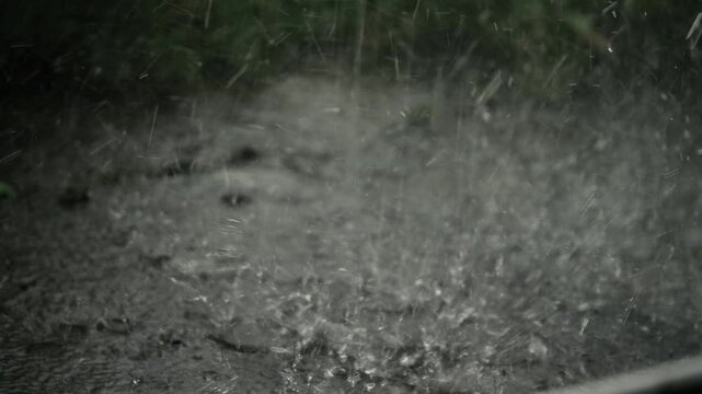Heavy rain falls and floods on pavement