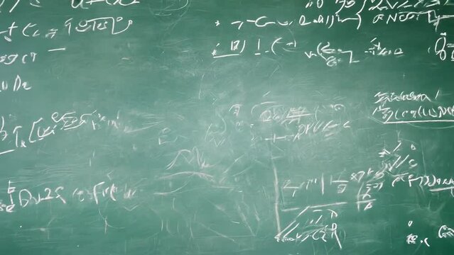 Green chalkboard with mathematical equations and scribbles