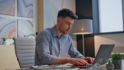 Focused guy working laptop in buro closeup. Stressed nervous man trying to calm