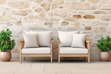 Two comfy wooden armchairs with pillows on a stone wall background and plants in pots nearby