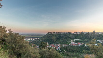 Panorama showing sunset over the Castle of Almourol on hill in Santarem aerial timelapse. Portugal