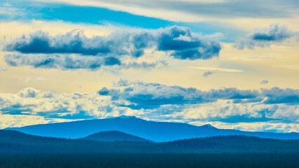 Fototapeta premium Aerial View of Oregon Forest Mountains and Dramatic Sky