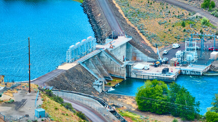 Aerial View of Hydroelectric Dam and Power Substation in Rugged Terrain
