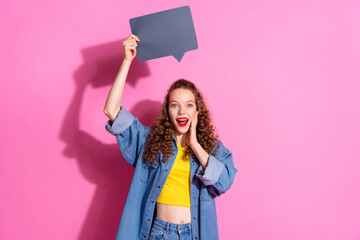 Photo of cheerful pretty lady dressed denim jacket rising mind cloud empty space isolated pink color background