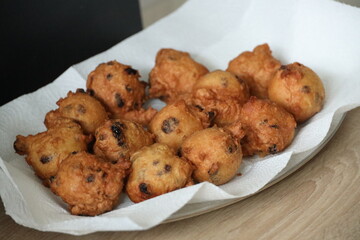 Baking of the Traditional oliebollen or Dutch doughnuts eaten at New Years Eve