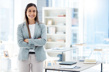 Portrait, arms folded and businesswoman in office for professional career and pride for job. Female person, smile and human resources management for corporate company or law firm in New York city