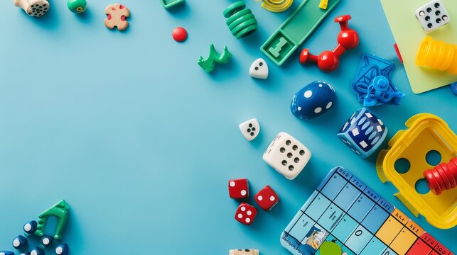 Colorful dice and game pieces are scattered on a blue background, symbolizing the fun and creativity involved in gaming and the various elements that make board games enjoyable.