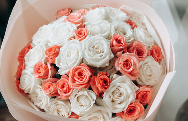 Gift wedding bouquet of white, yellow and red roses