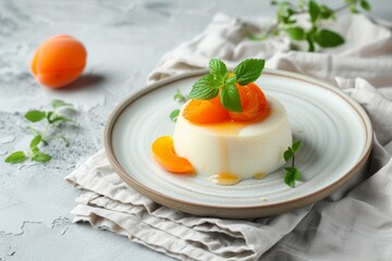Apricot Panna Cotta on gray background with linen napkin
