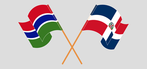 Crossed and waving flags of the Gambia and Dominican Republic